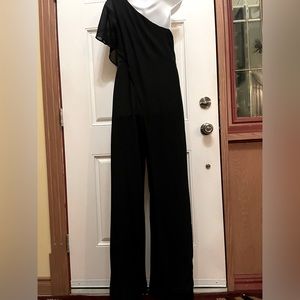 Le chateau one Shoulder black Jumpsuit with a black sheer overlay. Very Elegant